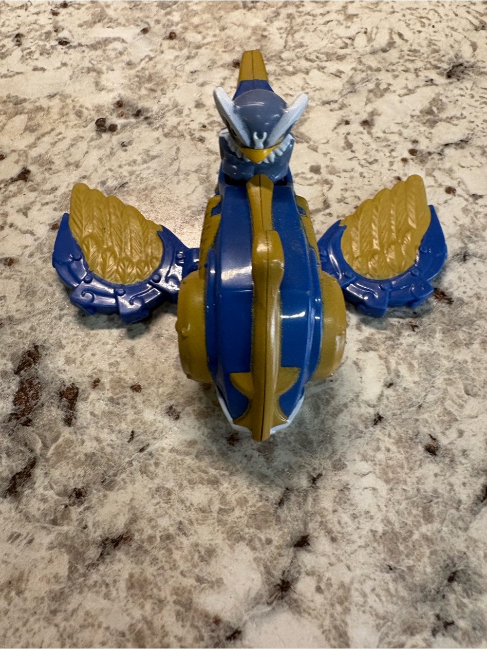 Blue and Gold Flying Creature Action Figure Toy